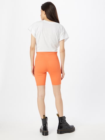 LEVI'S ® - Slimfit Leggings 'Youth Bike Short' en naranja