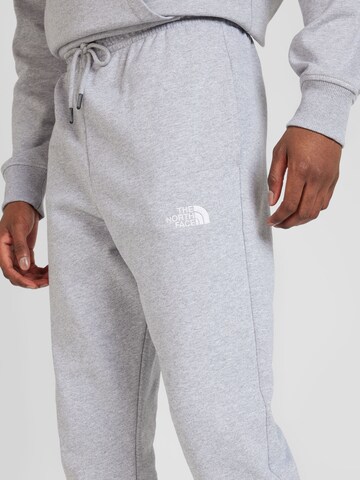 Effilé Pantalon 'ESSENTIAL' THE NORTH FACE en gris