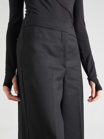 Calvin Klein Štandardný strih Nohavice s pukmi - Čierna