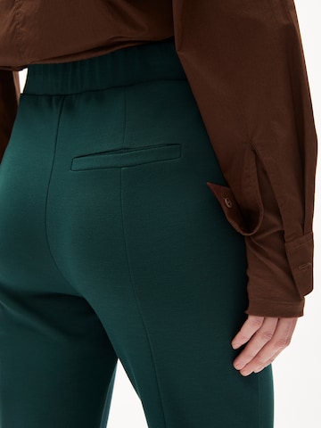 ARMEDANGELS Flared Pants 'LEYLAARI' in Green