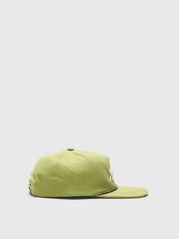 SELECTED - Gorra 'Selected x Hotel Amour' en verde