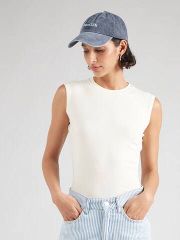 Top de la Champion Authentic Athletic Apparel pe bej: față