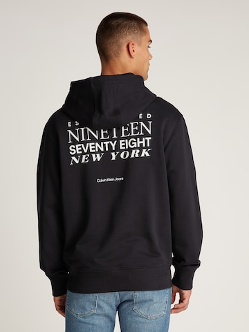 Calvin Klein JeansSweater majica - crna boja: prednji dio