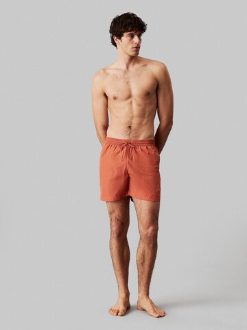 Pantaloncini da bagno di Calvin Klein Swimwear in arancione