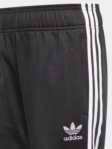 ADIDAS ORIGINALS Tapered Sports trousers 'Adicolor Sst' in Black