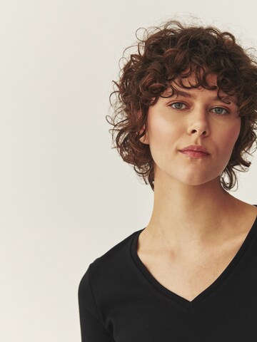 TATUUM - Camiseta 'Fini' en negro