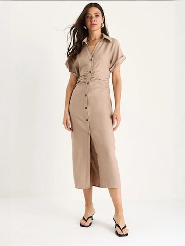 Bianco Lucci Dress in Beige: front
