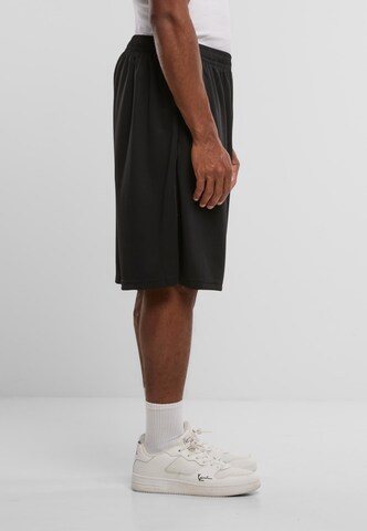 Regular Pantalon Karl Kani en noir