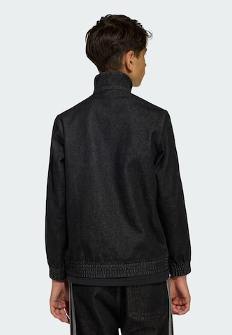 ADIDAS ORIGINALS - Chaqueta de entretiempo 'Firebird' en negro