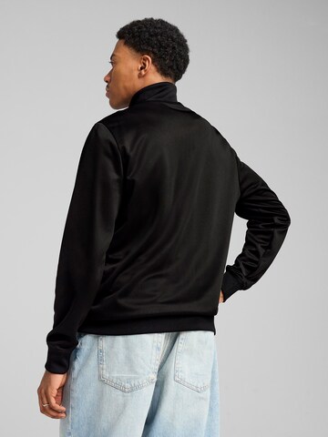 PUMA Trainingsjacke 'Ess No. 1' in Schwarz