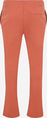 ADIDAS BY STELLA MCCARTNEY - Flared Calças de desporto 'Truecasuals ' em laranja