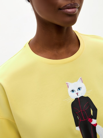 T-shirt 'Sport Cat with Dumbbells' Cat e Lolette en jaune