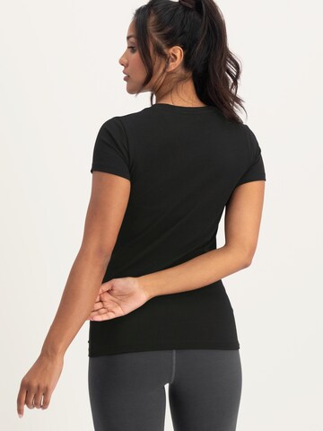 Urban Goddess Yoga & Activewear Sporttop 'Om Core Yoga and Pilates' in Schwarz