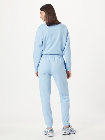 Effilé Pantalon de sport LACOSTE en bleu