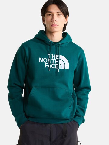THE NORTH FACE Bluzka sportowa 'THE NORTH FACE M ESS DP REG HODDIE FELPA' w kolorze zielony