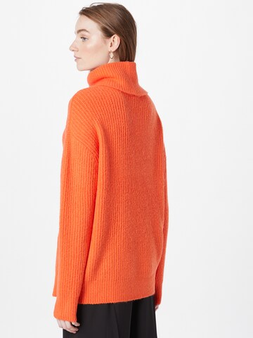 Cartoon Pullover in Orange