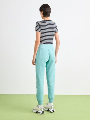 Nike Sportswear Tapered Byxa 'Phnx Flc' i grön