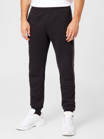 Tapered Pantaloni de la Champion Authentic Athletic Apparel pe negru: față