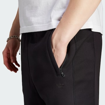ADIDAS ORIGINALS Lużny krój Spodnie w kolorze czarny