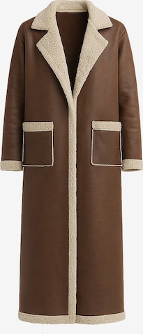 Elara Janker in Braun: Vorderseite