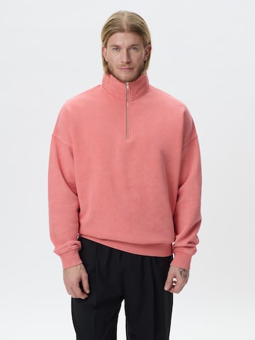 KARIA by Loris Karius Μπλούζα φούτερ σε πορτοκαλί: μπροστά