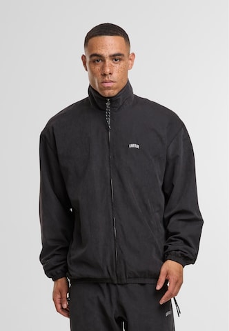 Unfair Athletics Between-season jacket in Black: front