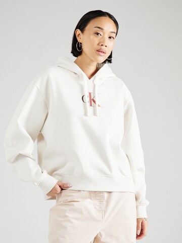 Sweat-shirt Calvin Klein Jeans en beige : devant