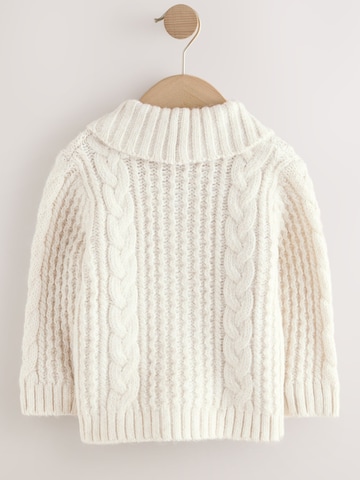 Next Neuletakki värissä beige