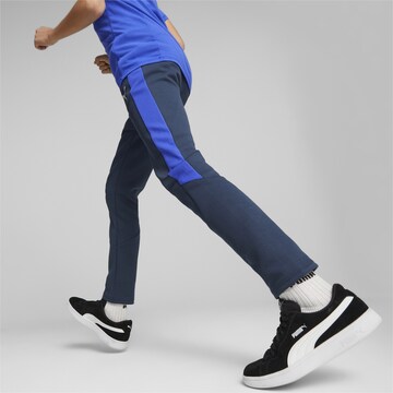 PUMA Slimfit Spodnie sportowe 'Evostripe' w kolorze niebieski