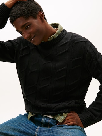 Pull-over Tommy Jeans en noir