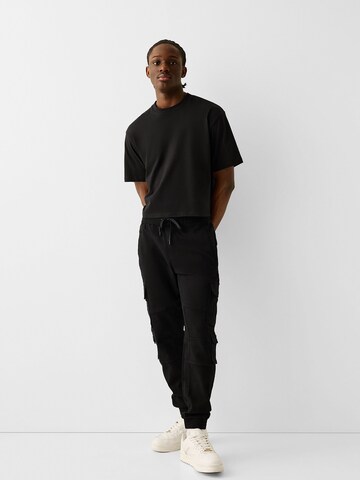 Bershka Tapered Cargo nadrágok - fekete