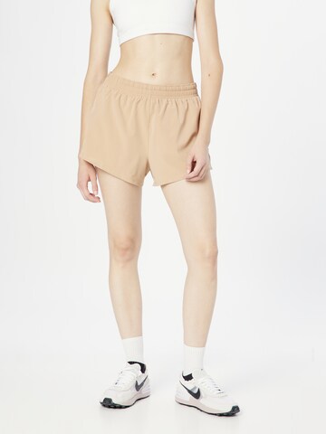 NIKE Regular Sports trousers in Beige: front