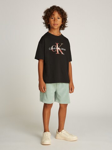 Calvin Klein Jeans Paita 'OCEAN SWIRL' värissä musta: etupuoli