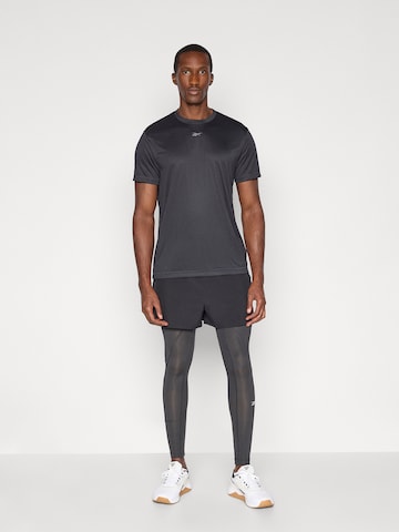 Reebok - Camisa funcionais 'ID TRAIN' em preto