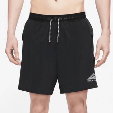 NIKE Regular Pants in Black: front