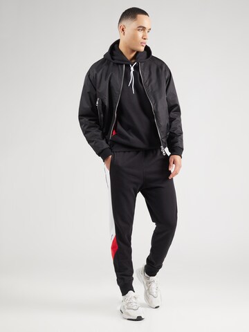 Felpa di Champion Authentic Athletic Apparel in nero