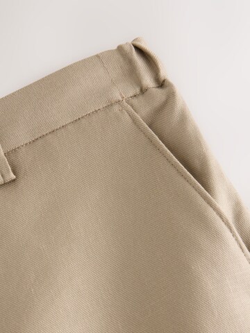 Coupe slim Pantalon à plis 'Motionflex' Next en gris