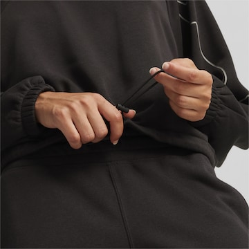 PUMA - Sweatshirt de desporto 'Motion' em preto