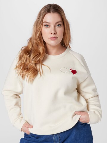 Calvin Klein CurveSweater majica - bež boja: prednji dio