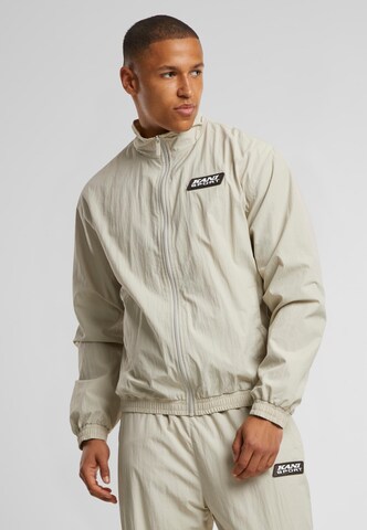 Karl Kani Between-season jacket 'Essential' in Beige: front