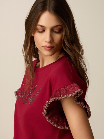 Maglietta di oltre in rosso