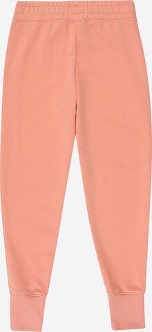 Nike Sportswear Tapered Broek in Oranje