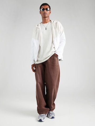 Tricou 'ESS' de la Nike Sportswear pe bej