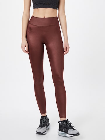 Skinny Pantalon de sport NIKE en marron : devant