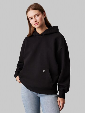 Sweat-shirt Calvin Klein Jeans en noir : devant