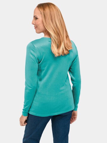 Goldner Pullover in Blau