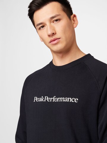 PEAK PERFORMANCE Sportsweatshirt i svart