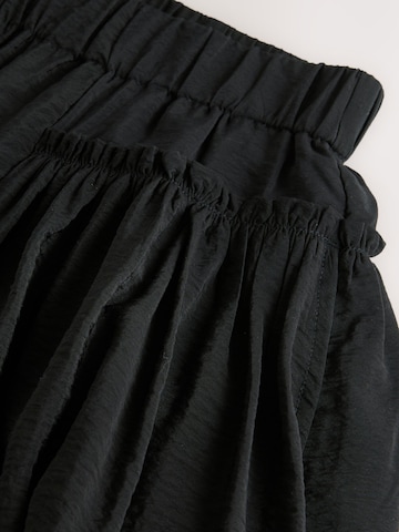 Next - Loosefit Pantalón en negro