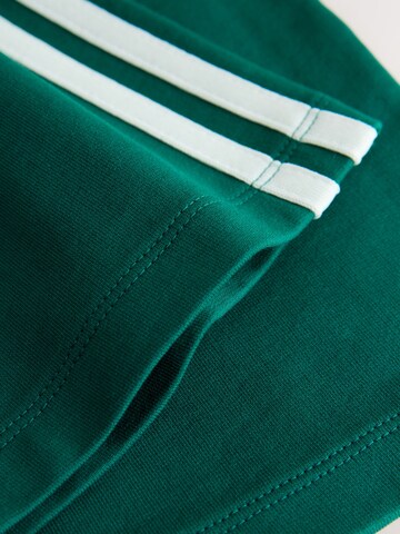 Next - Pierna ancha Pantalón en verde