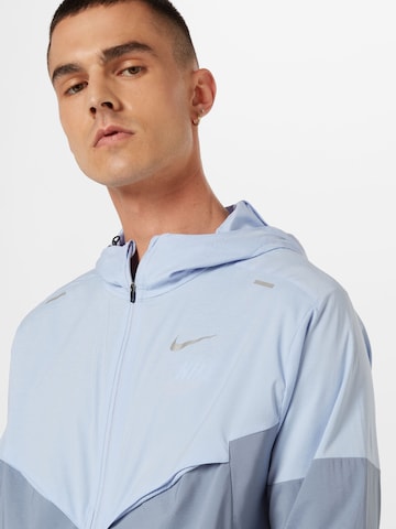 Veste de sport NIKE en bleu